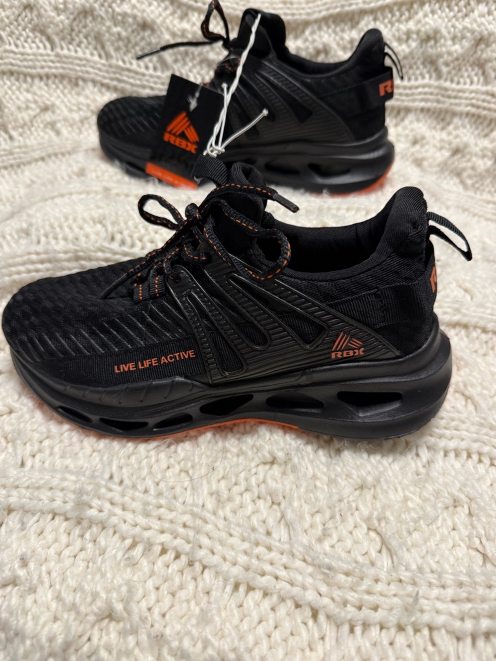 Reebok Black Sneakers with Orange Details